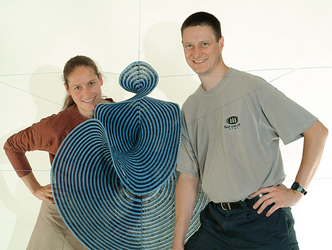 Hinke Osinga and Bernd Krauskopf with
their crocheted Lorenz manifold